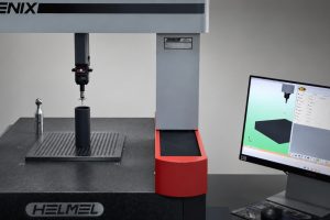 Máquina de medición por coordenadas (CMM) utilizada para verificar las tolerancias dimensionales de una pieza de grafito industrial.